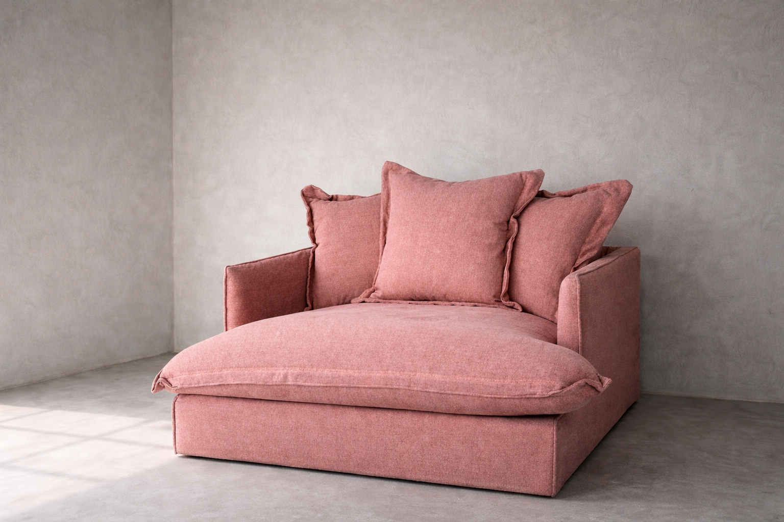 Goa armchair in smoked rose linen featuring a low wide seat, oversized back cushions and natural hemp-linen texture