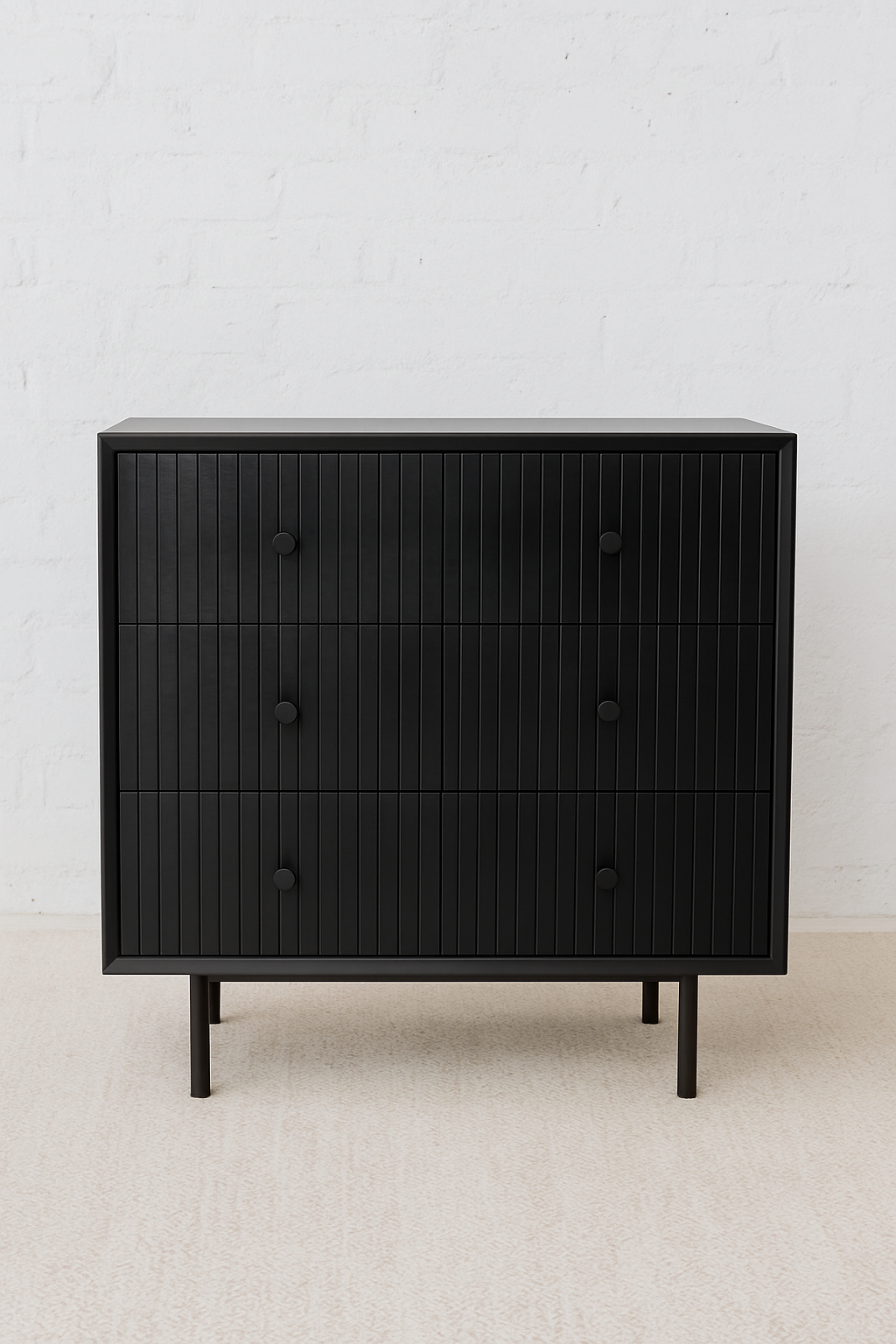 Mekele Cabinet in black solid teak with vertical fluted drawers, black round knobs, and slim black metal base, handcrafted three-drawer chest for boutique hotels, luxury lodges, and high-end interiors.