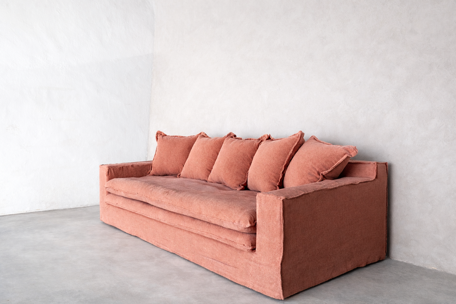 Wasini linen sofa in smoked rose with layered seat and structured silhouette.