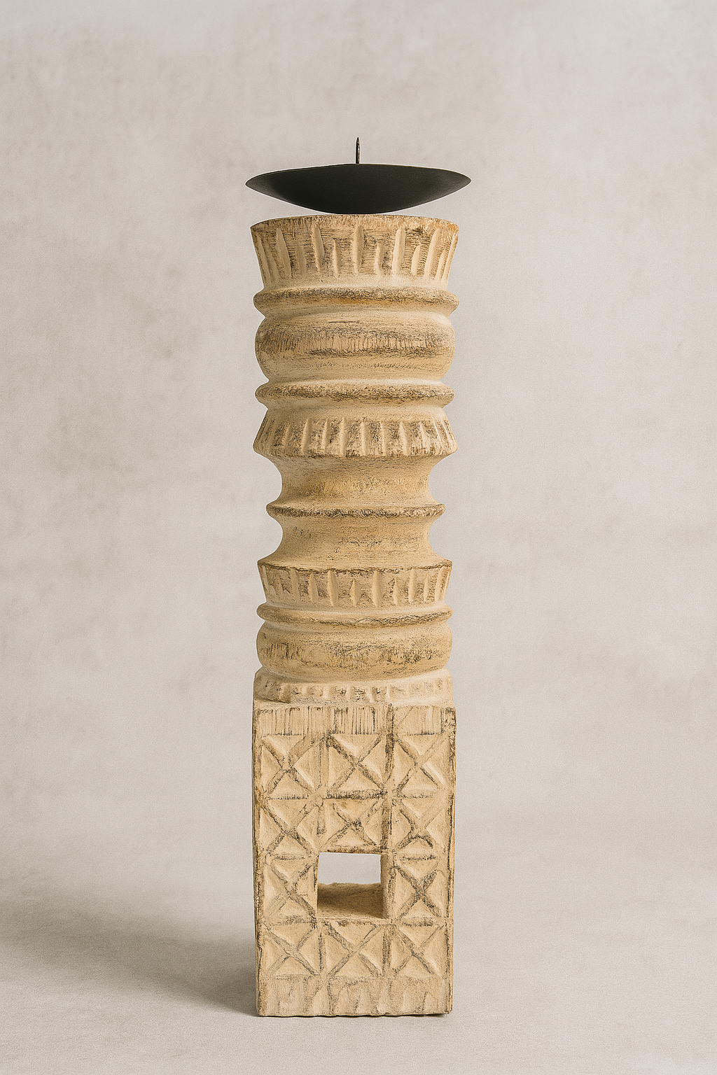 Decorative candle holder with geometric patterns on a beige background