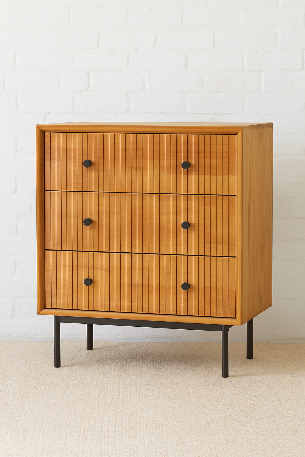 Mekele Cabinet in solid teak with vertical fluted drawers, black round knobs, and slim black metal base, handcrafted three-drawer chest for boutique hotels, luxury lodges, and high-end interiors.