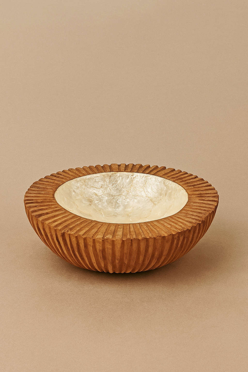 Hand-carved wooden bowl with deep vertical grooves and a polished lapiz shell interior, named Mbira