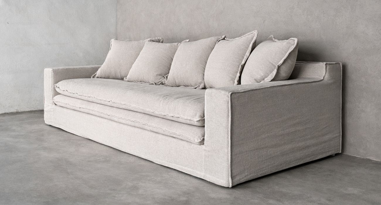 Wasini linen sofa in pumice with layered seat and structured silhouette.