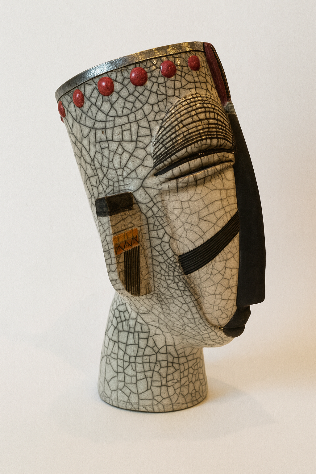 Handmade ceramic wine cooler with crackle glaze in the shape of an African mask, made in South Africa.