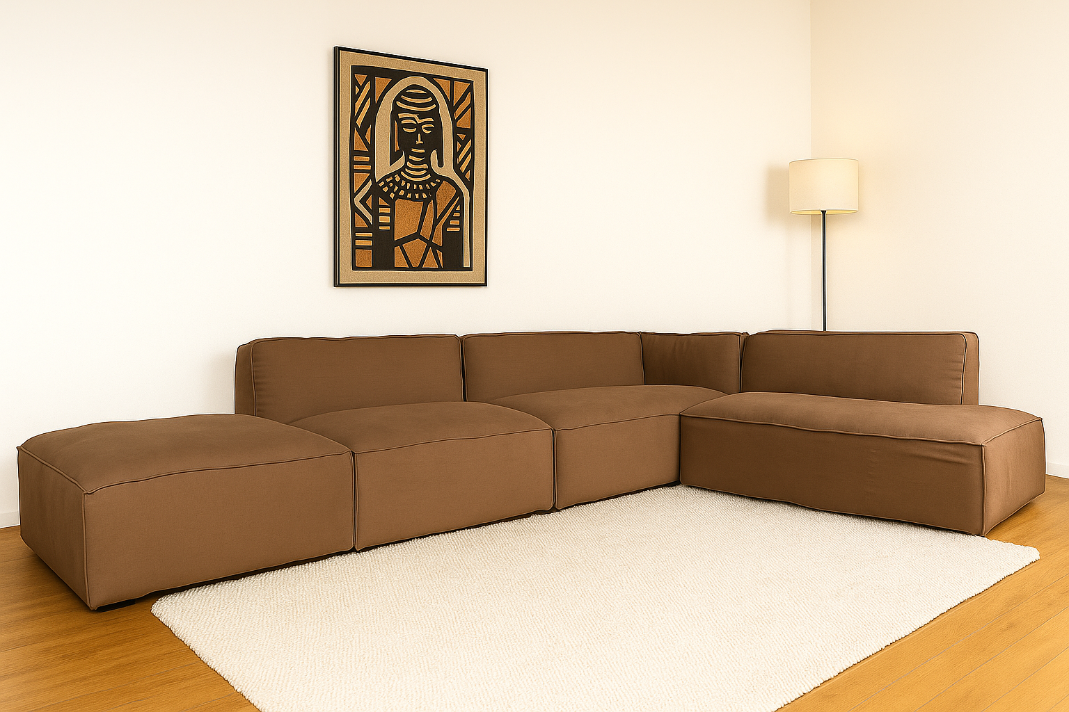 Modular grey linen-cotton Cube Sofa with low profile design, placed on a cream rug in a minimalist living room with wooden floors and Afro-inspired wall art.