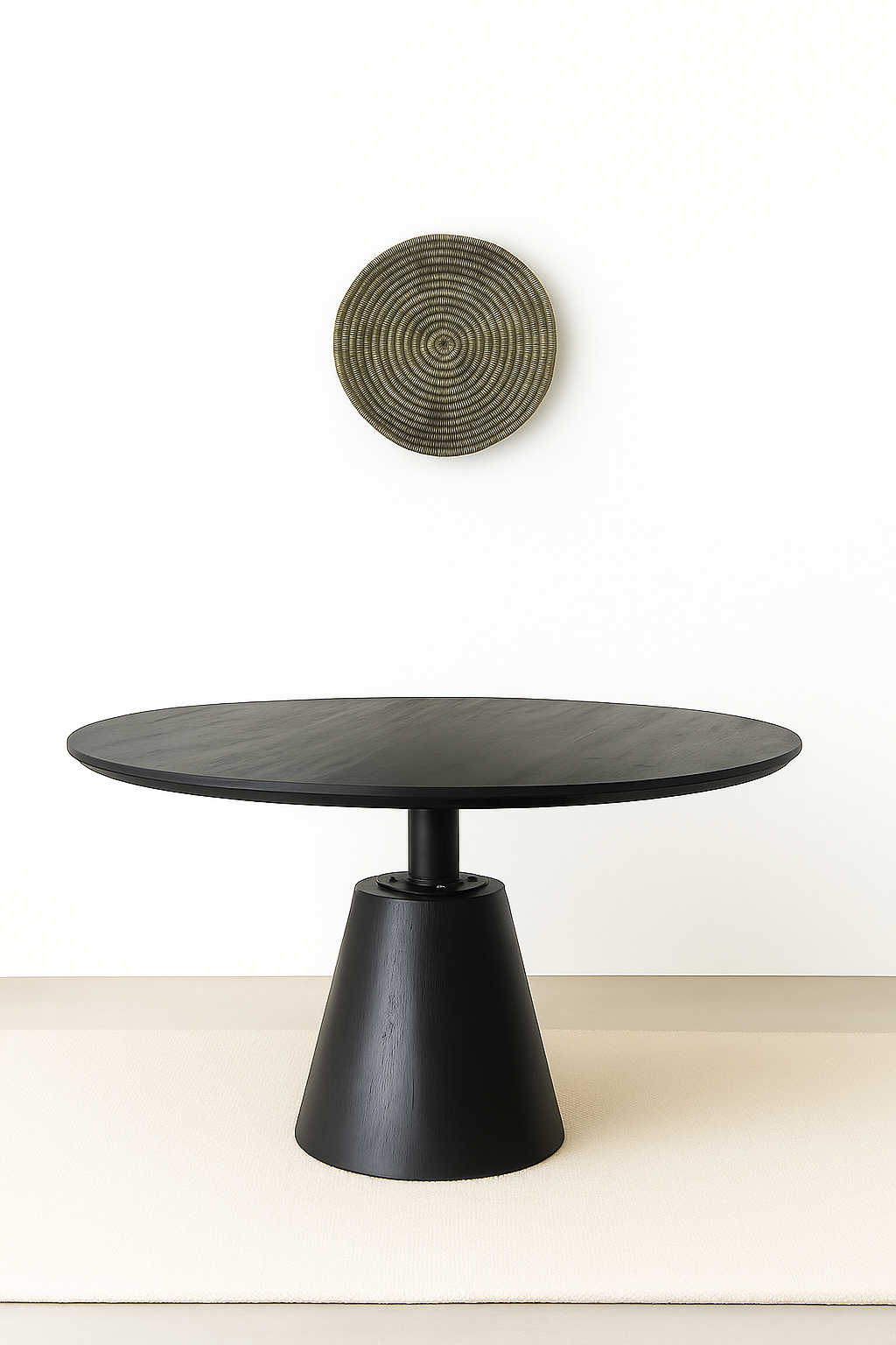 Round black pedestal dining table with conical wooden base and smooth matte finish