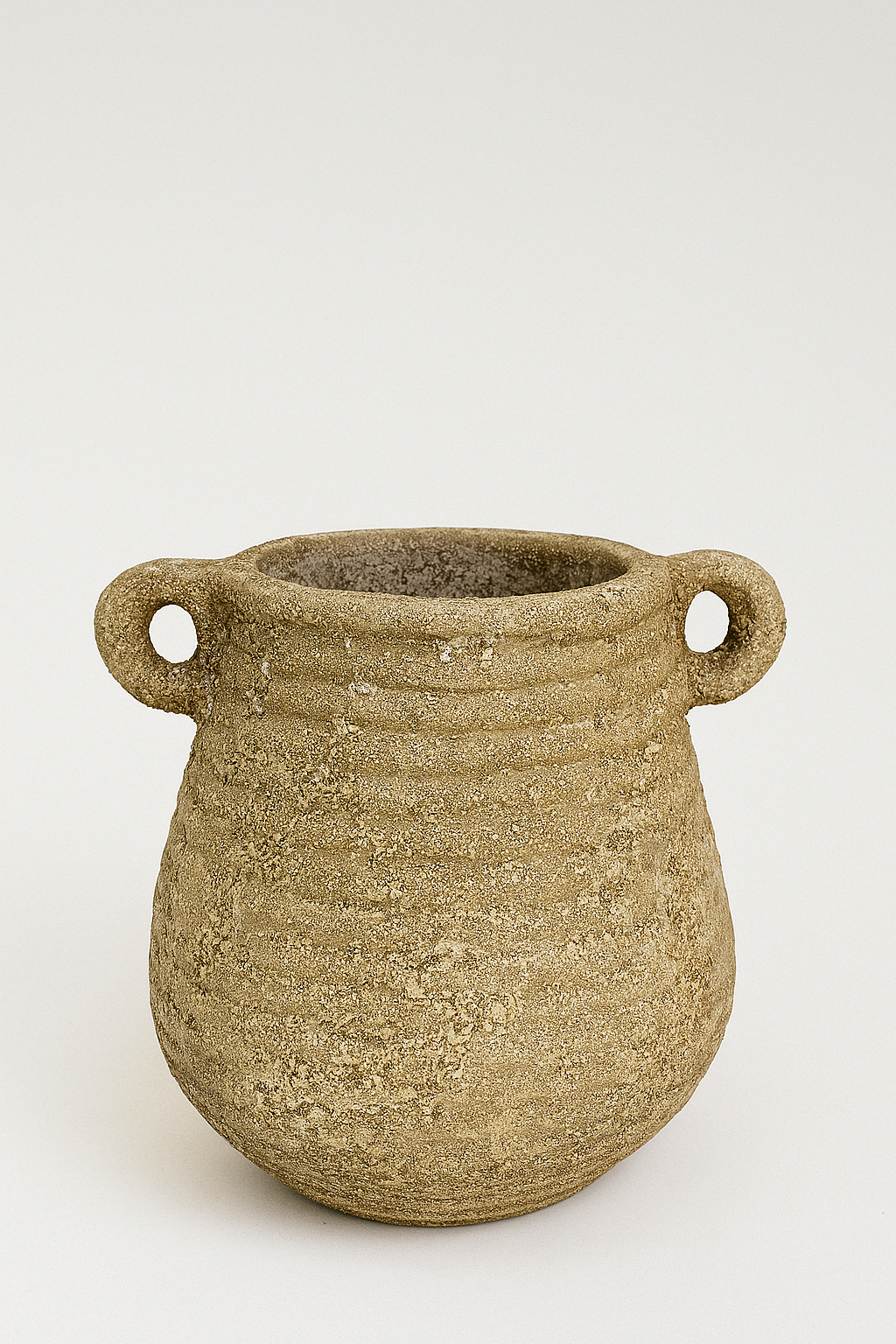 Brown ceramic pot with two handles on a white background