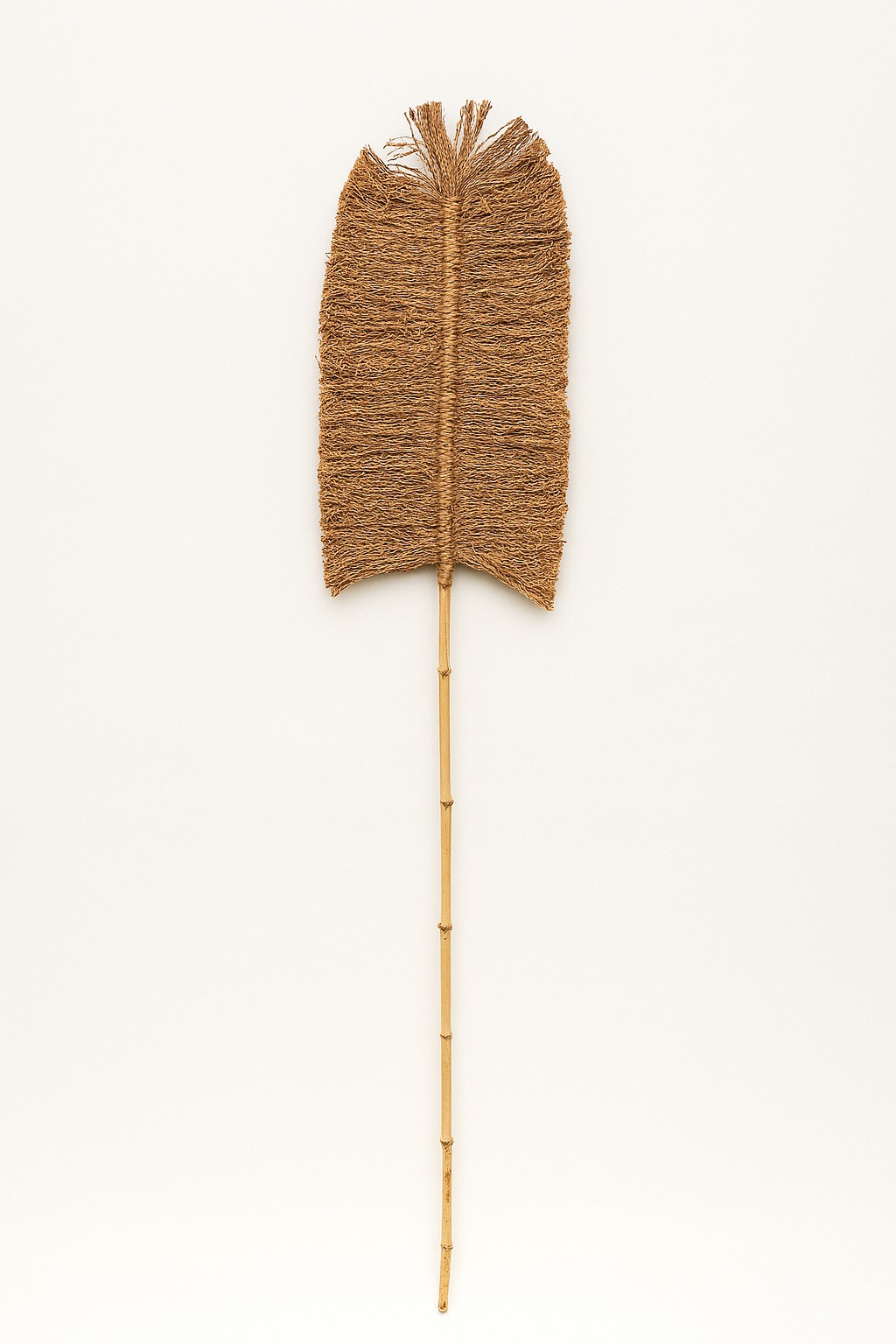 A single sisal rope and bamboo stick with twisted rope-like texture, styled as decorative objects