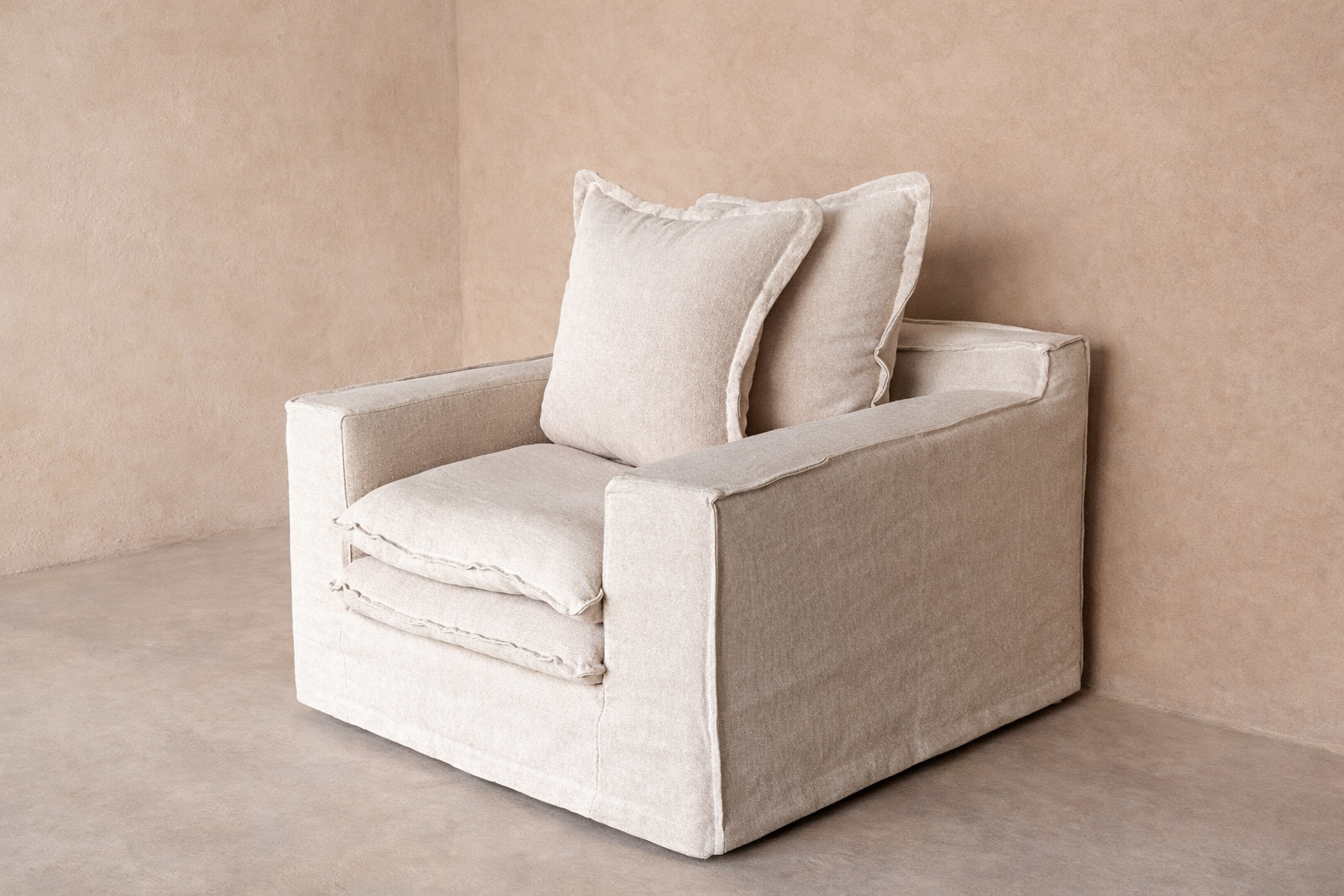 Wasini armchair upholstered in 100% linen with double-layer seat and structured arms.