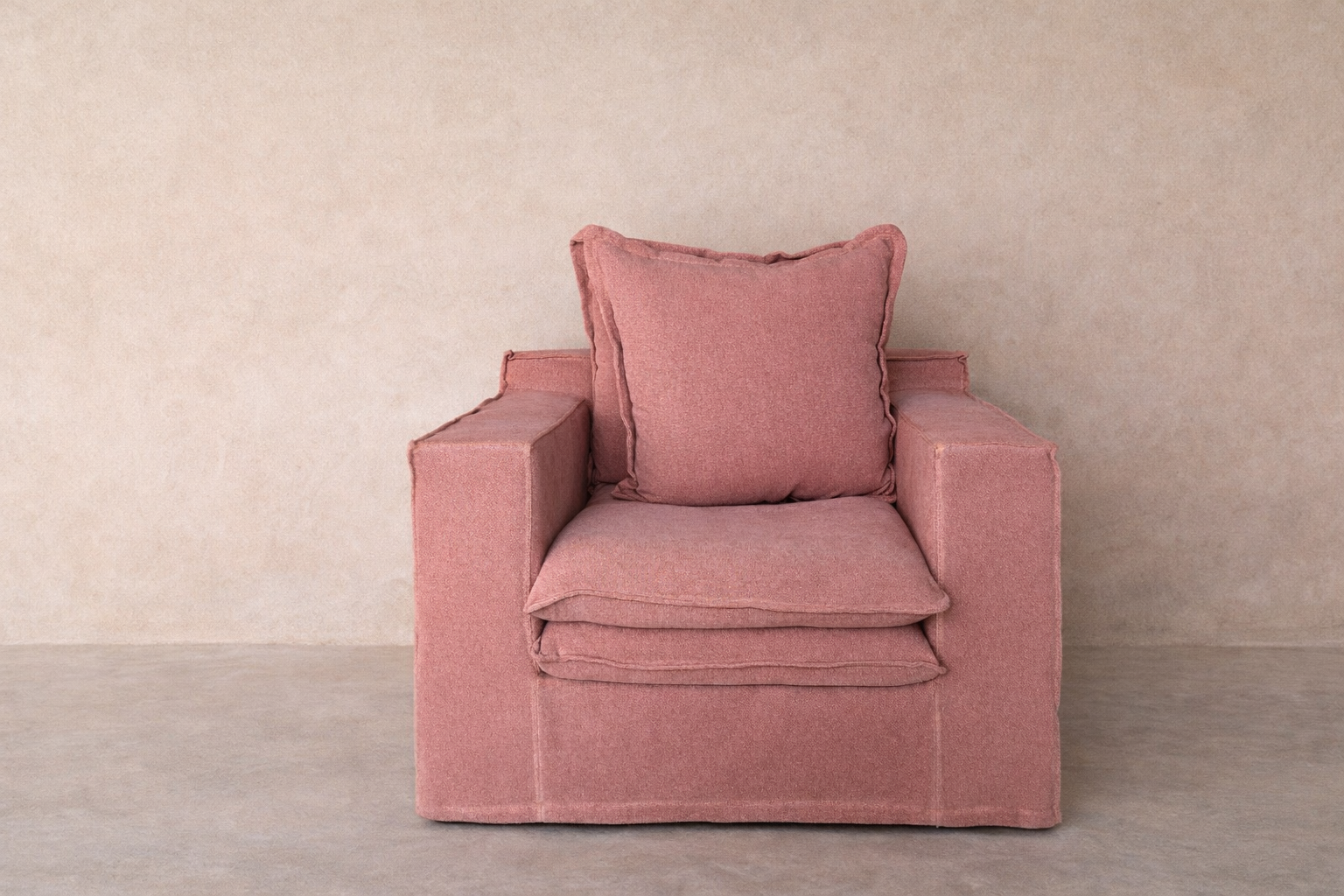Wasini armchair upholstered in 100% linen with double-layer seat and structured arms.