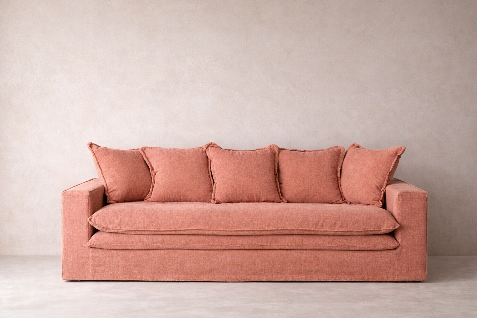 Wasini line sofa in smoked rose with layered seat and structured silhouette.